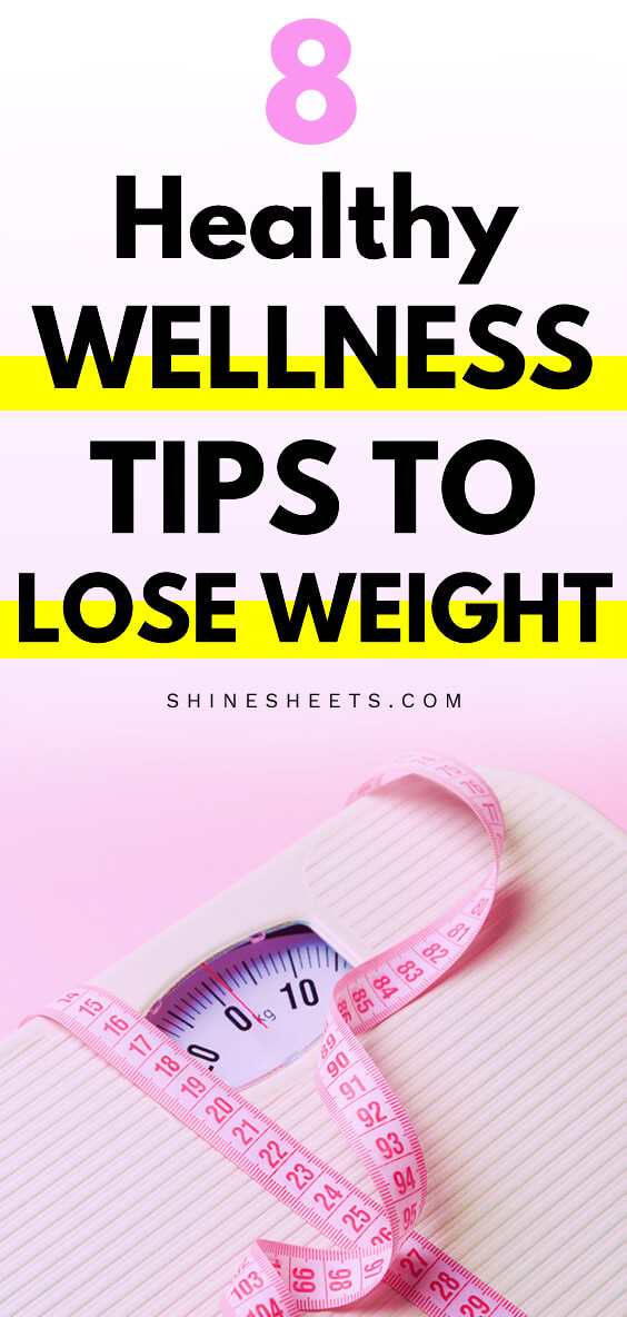 Weight scale on pink background and a pink measuring tape
