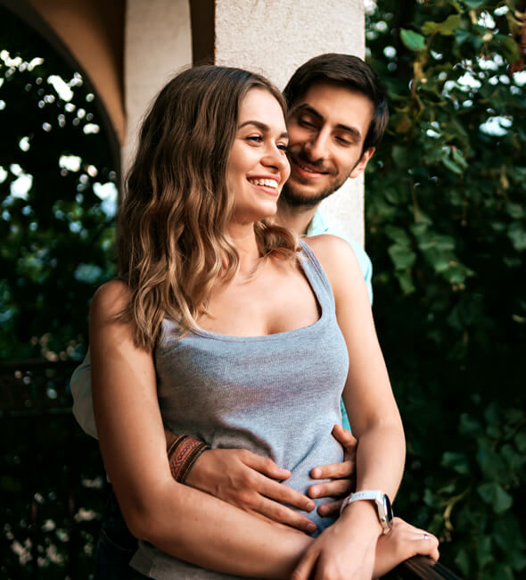 cute couple in love flirting in the balcony