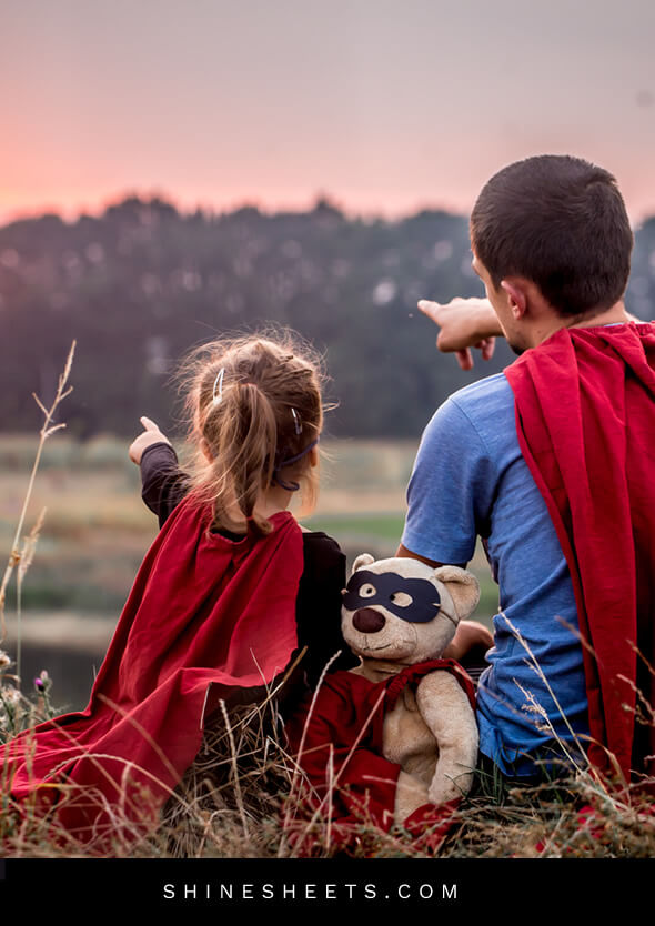 young girl and her father spending time with family by playing super heros