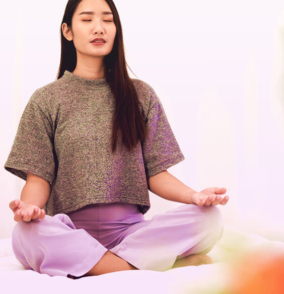 asian woman meditation on a meditation chair cross legged