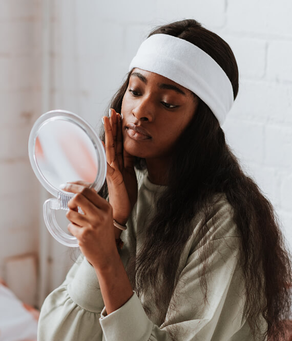 beautiful ethnic woman using enzyme peel on her face