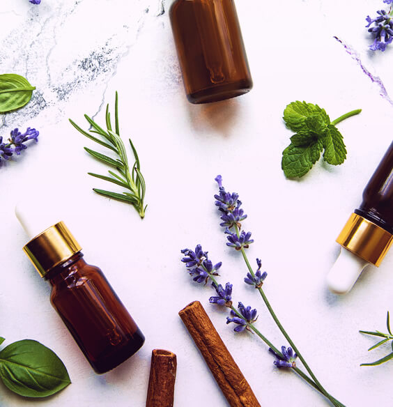 lavender flowers and essential oil on table
