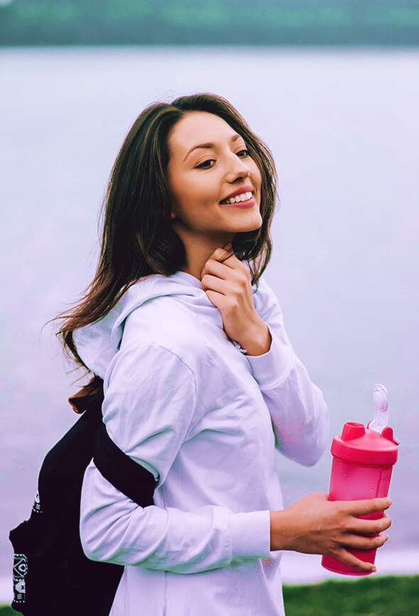 woman drinking a protein shake