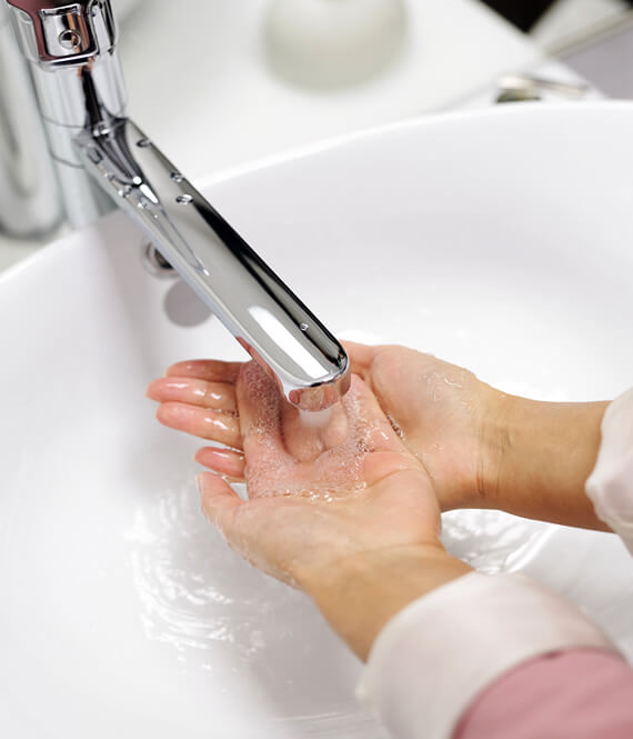 woman washing hand multiple times