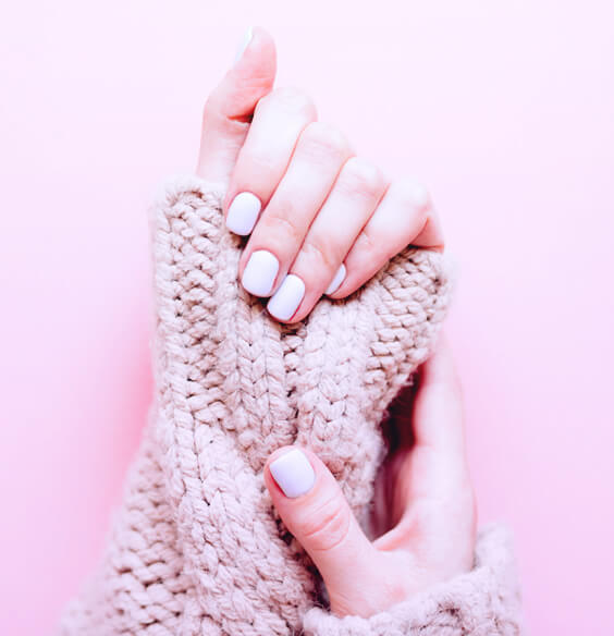 woman with manicure made with gel nail polish, learning how to make gel nails last longer