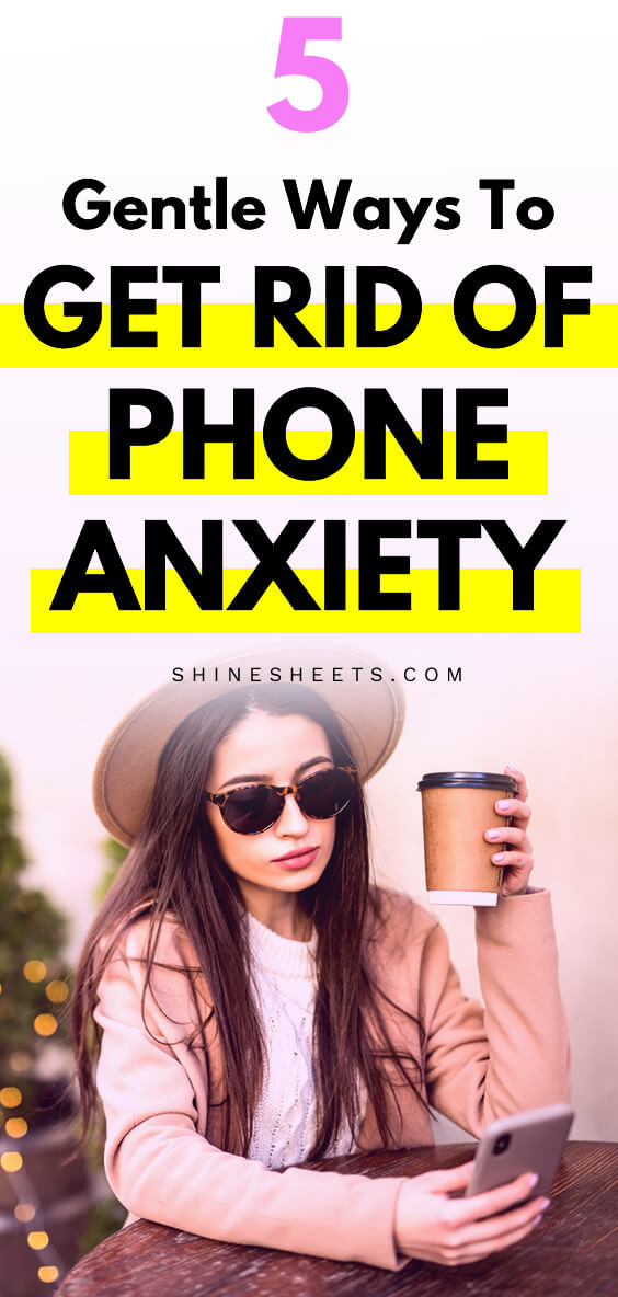 woman with a hat and phone anxiety looking at her phone