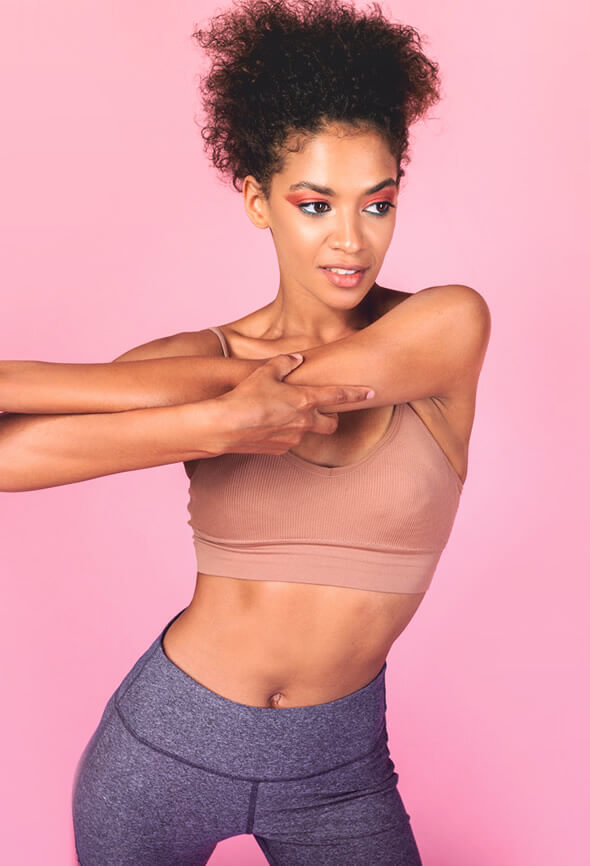 pretty black woman exercising in order to lose face fat