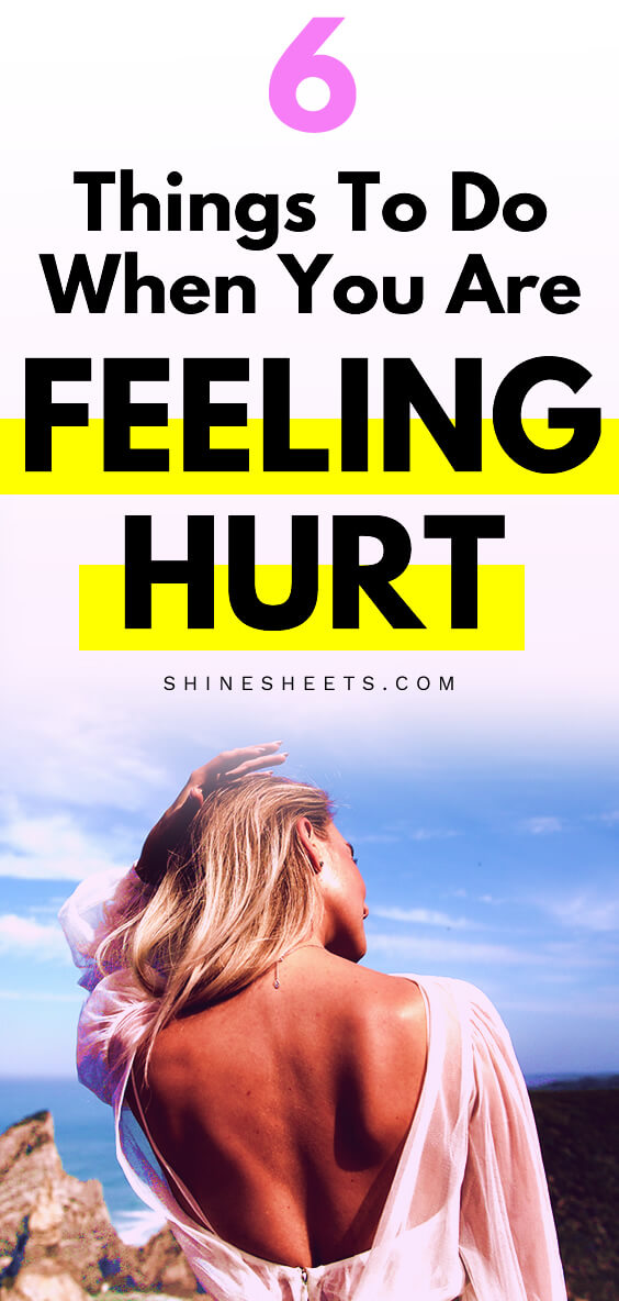 woman feeling hurt and smiling sadly back view
