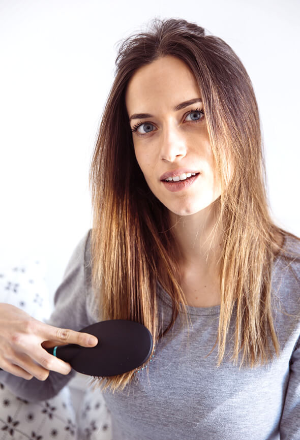 woman brushing her hair