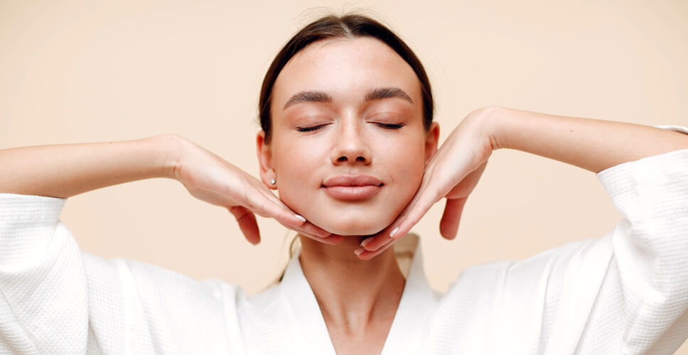 young woman doing face yoga exercises