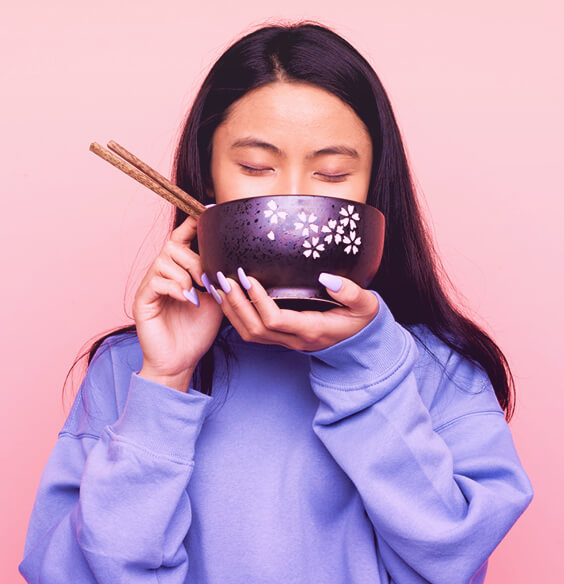 asian woman eating beauty foods from a bowl