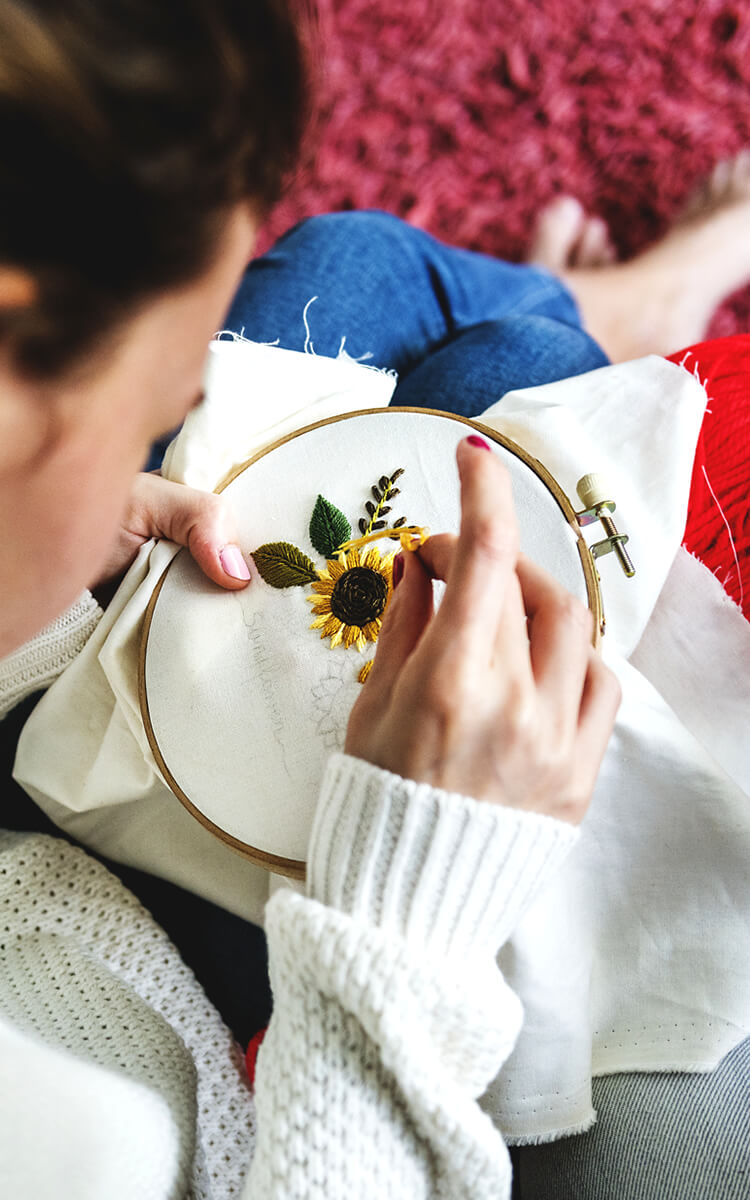 woman doing embroidery