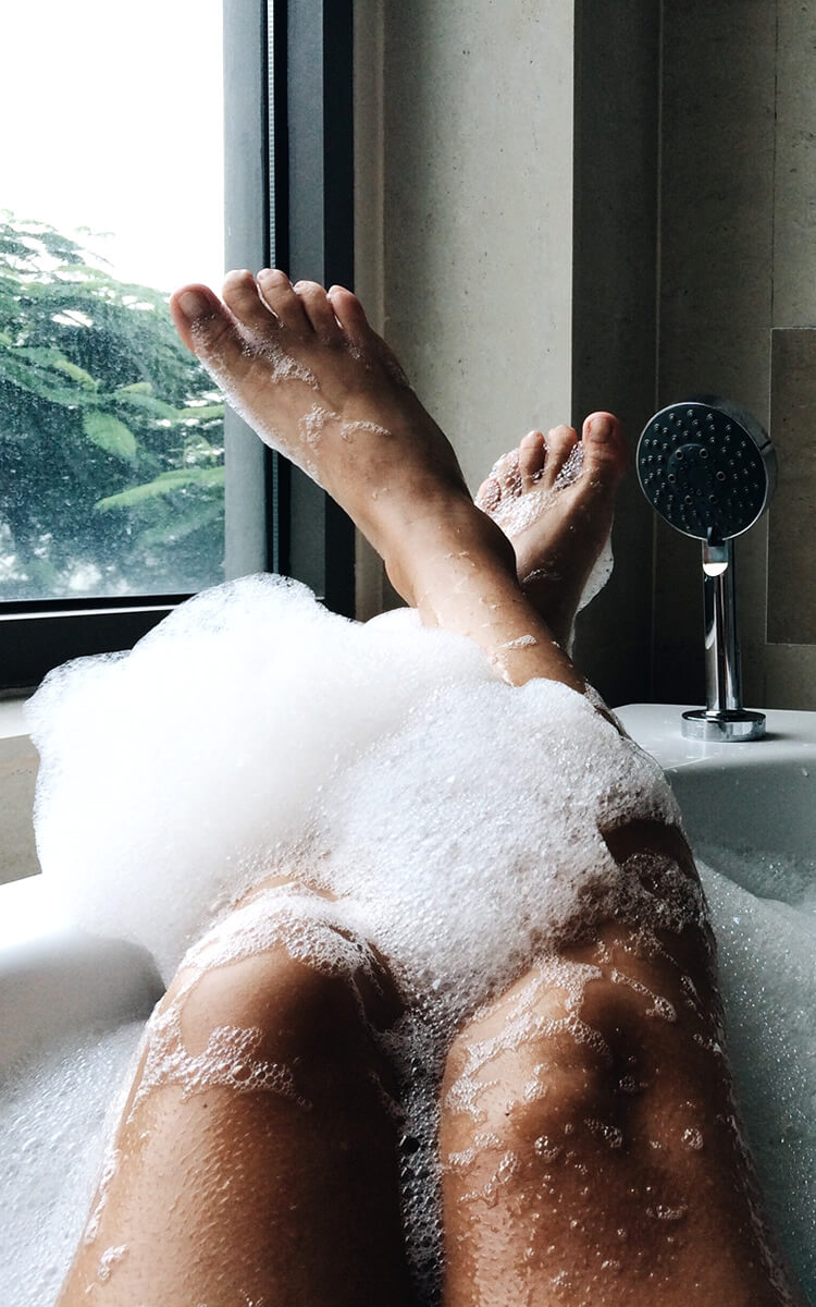 woman taking a bath to unwind after a busy day
