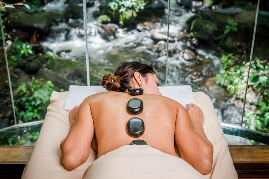 woman with hot stones on her back