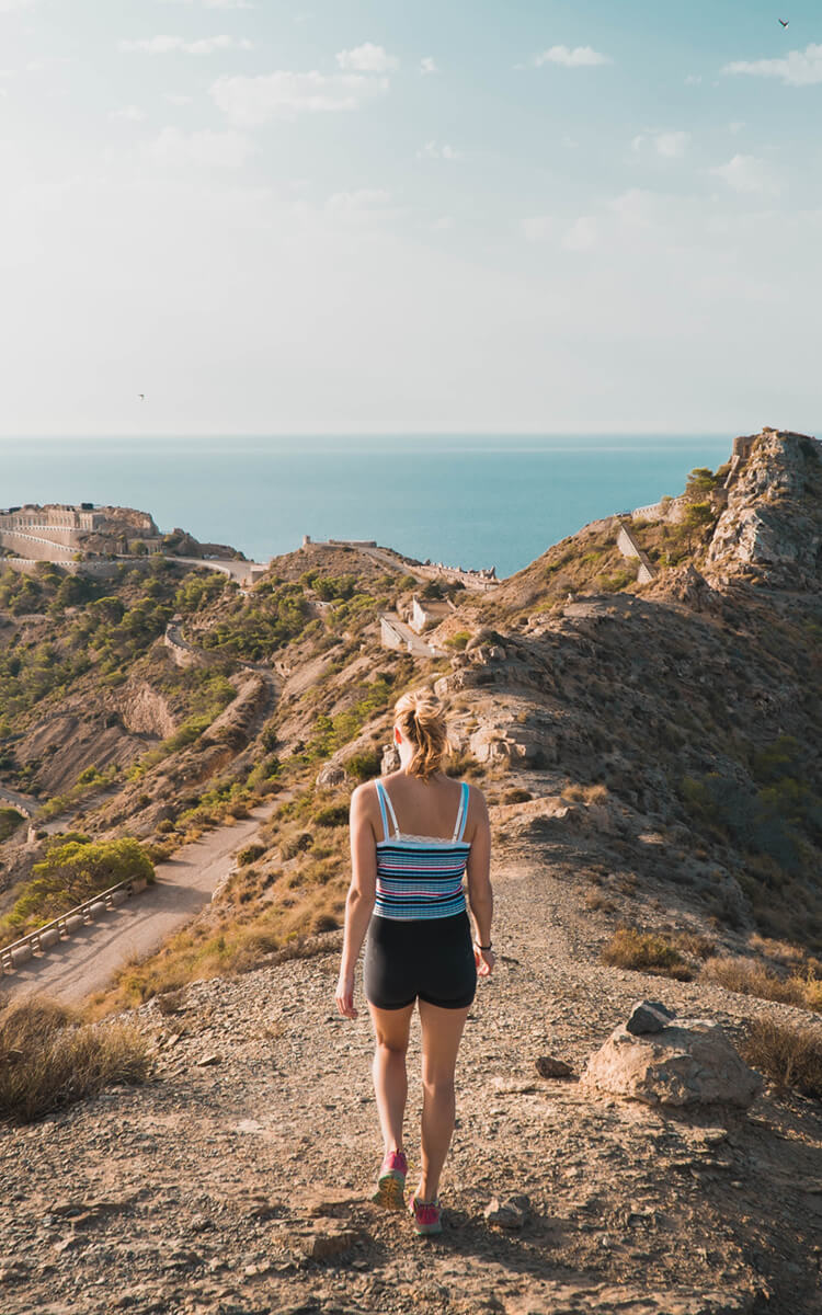 woman exploring different thinking styles by walking in nature