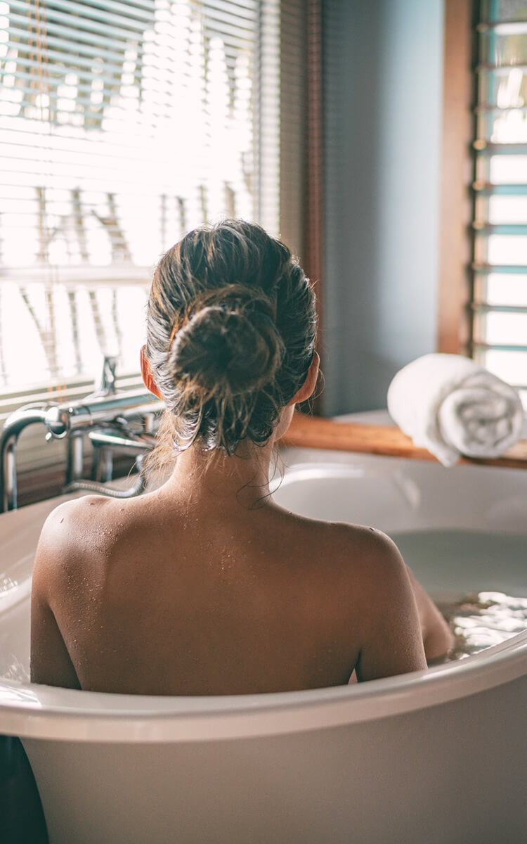 woman having a bath on her self care sunday