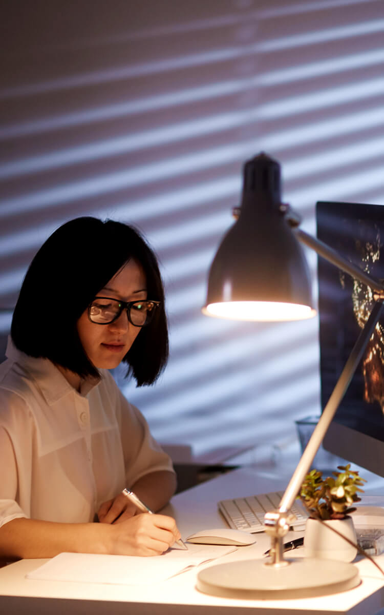woman planning her next day before bed