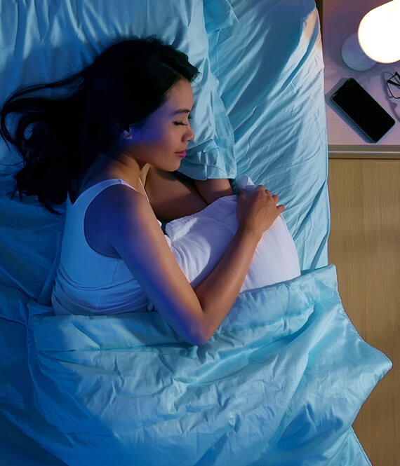 woman relaxing before sleep in a blue room
