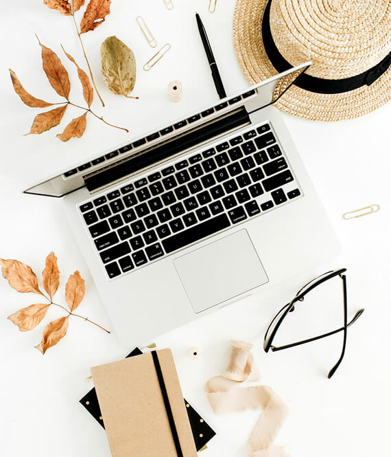 laptop and notebooks on table