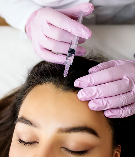mesotherapy for hair loss treatment performed on young asian female