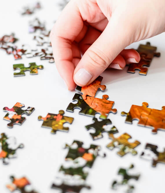person doing memory care with a puzzle