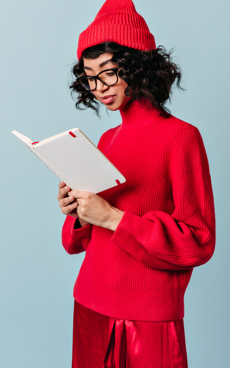 student reading her notebook