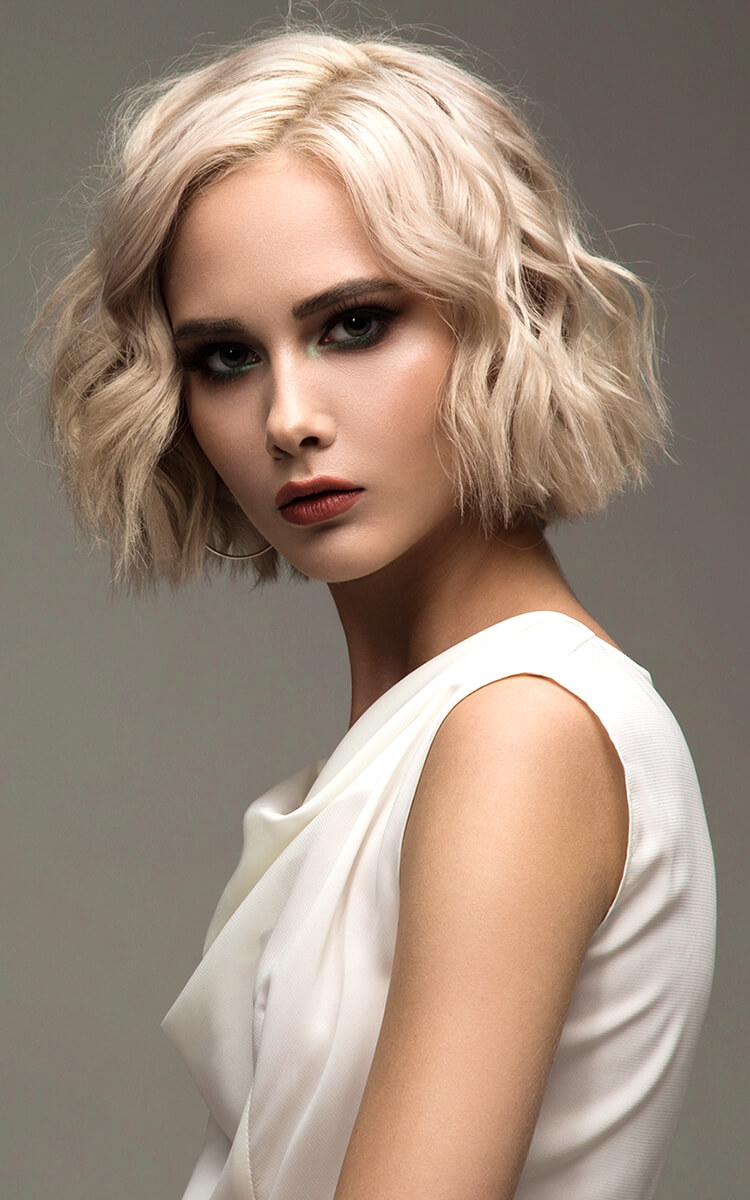woman with wavy hair with straight ends hairstyle