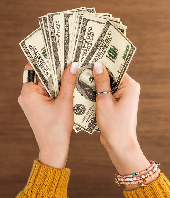 girl student holding dollars in her hand