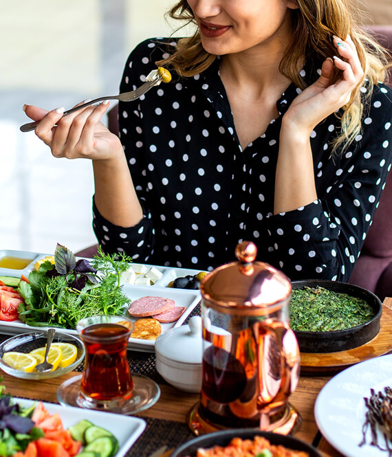 woman eating various collagen rich foods