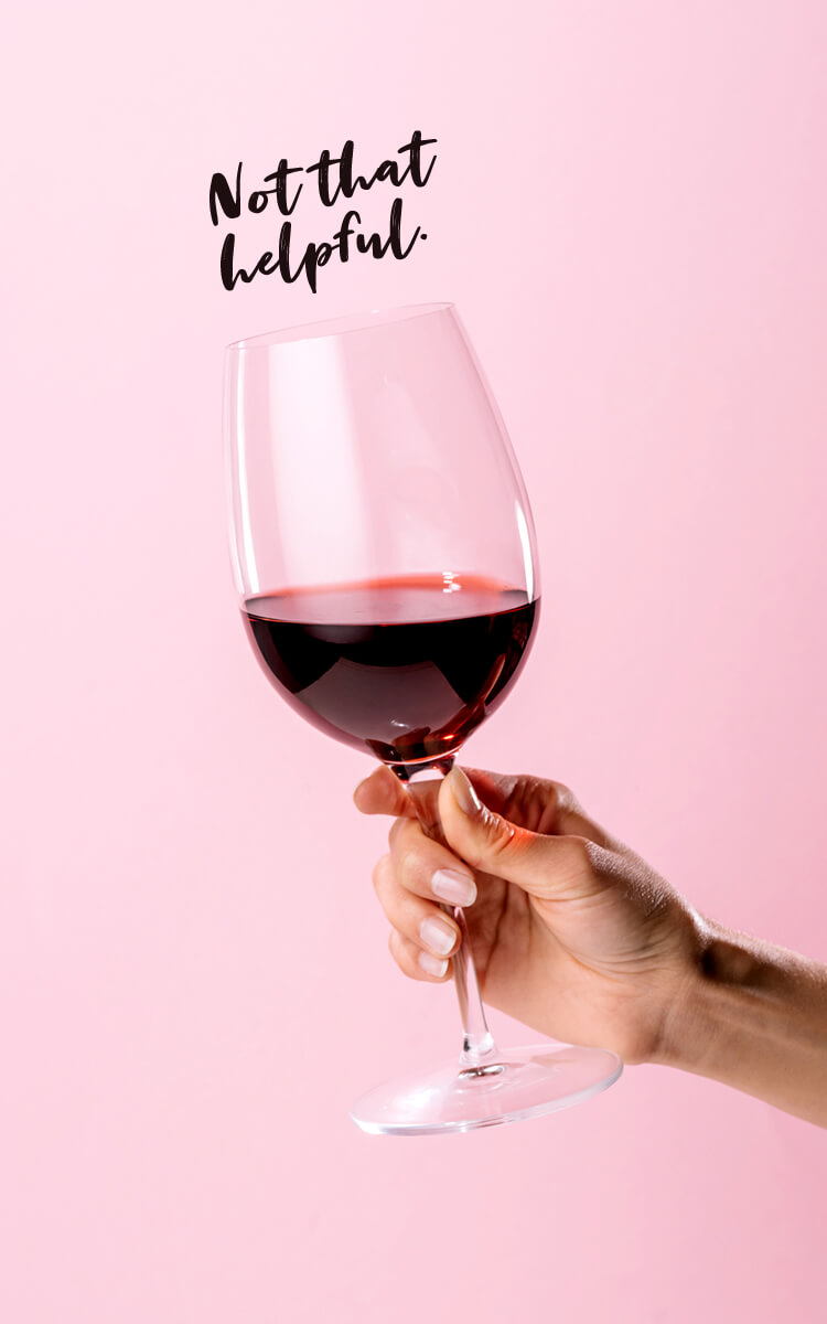 woman holding a glass of red wine