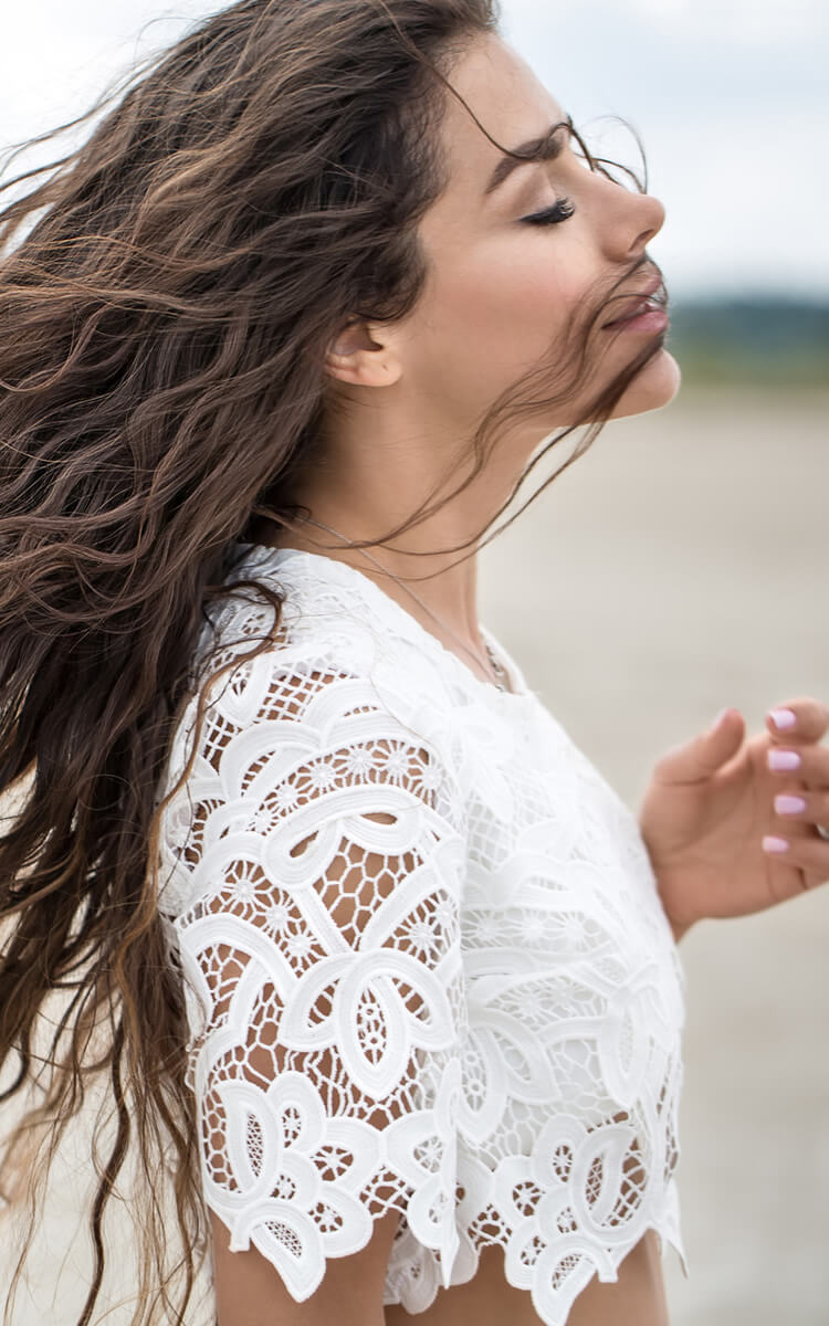woman taking a deep breath