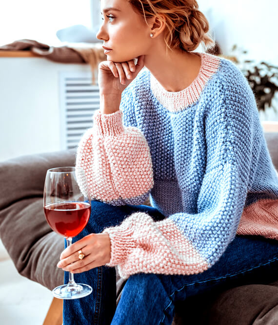 woman trying to calm her nerves with alcohol, alcohol and anxiety don't mix