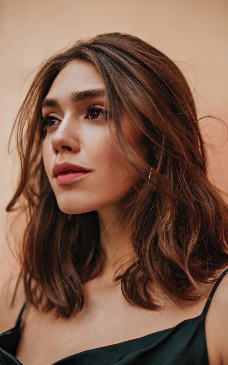 woman with wavy brown hair