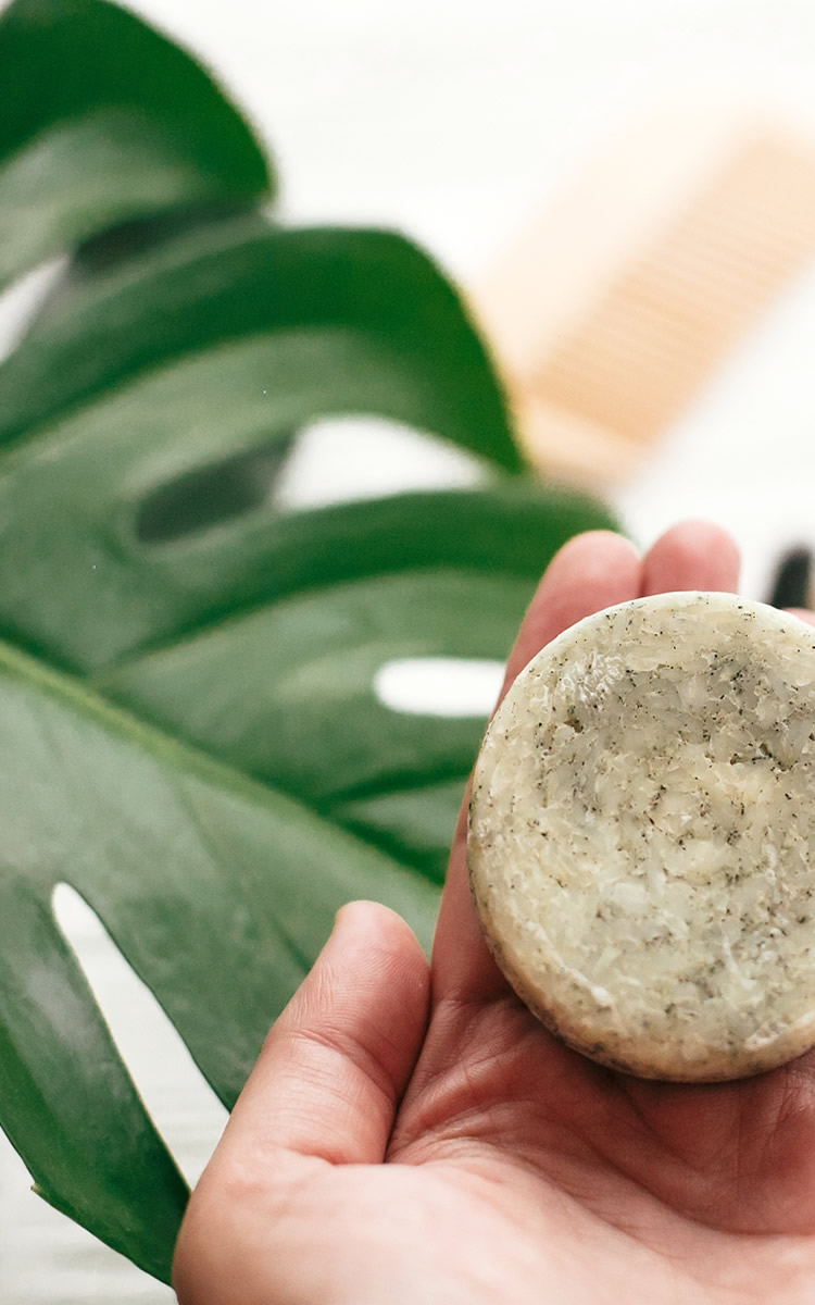 person holding tea tree soap in his hand