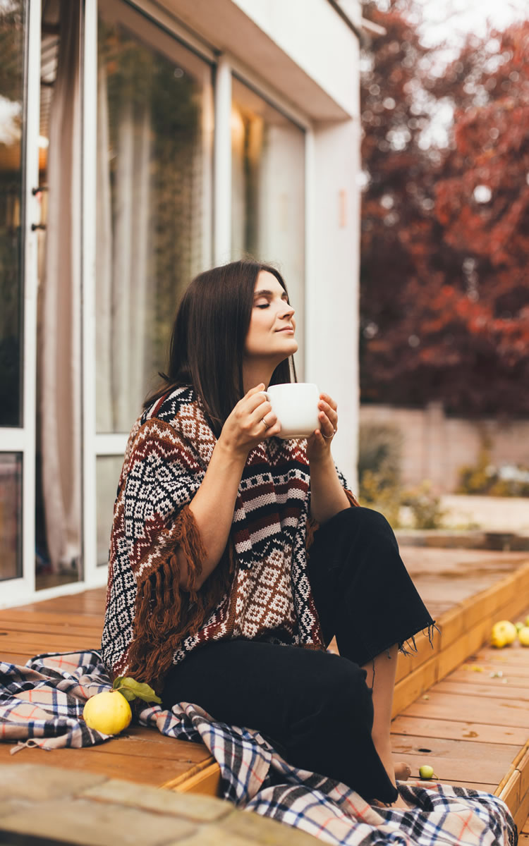 woman enjoying calming tea