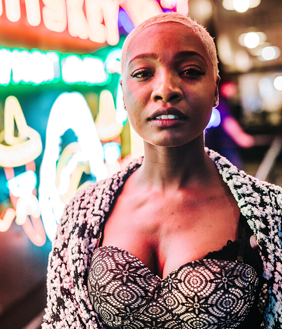beautiful black woman after breast augmentation confident