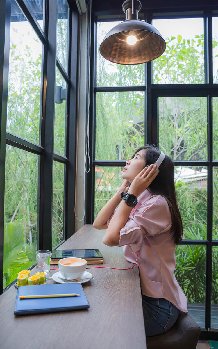 asian woman doing a freelance job on her laptop