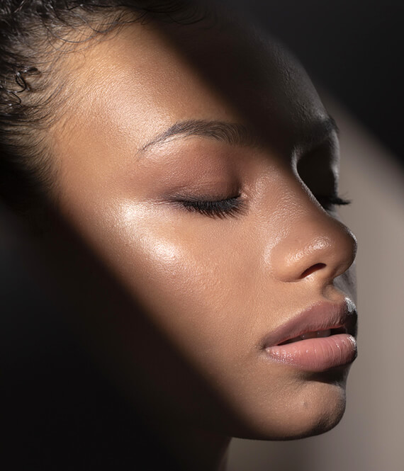 beautiful black woman with healthy skin on her face