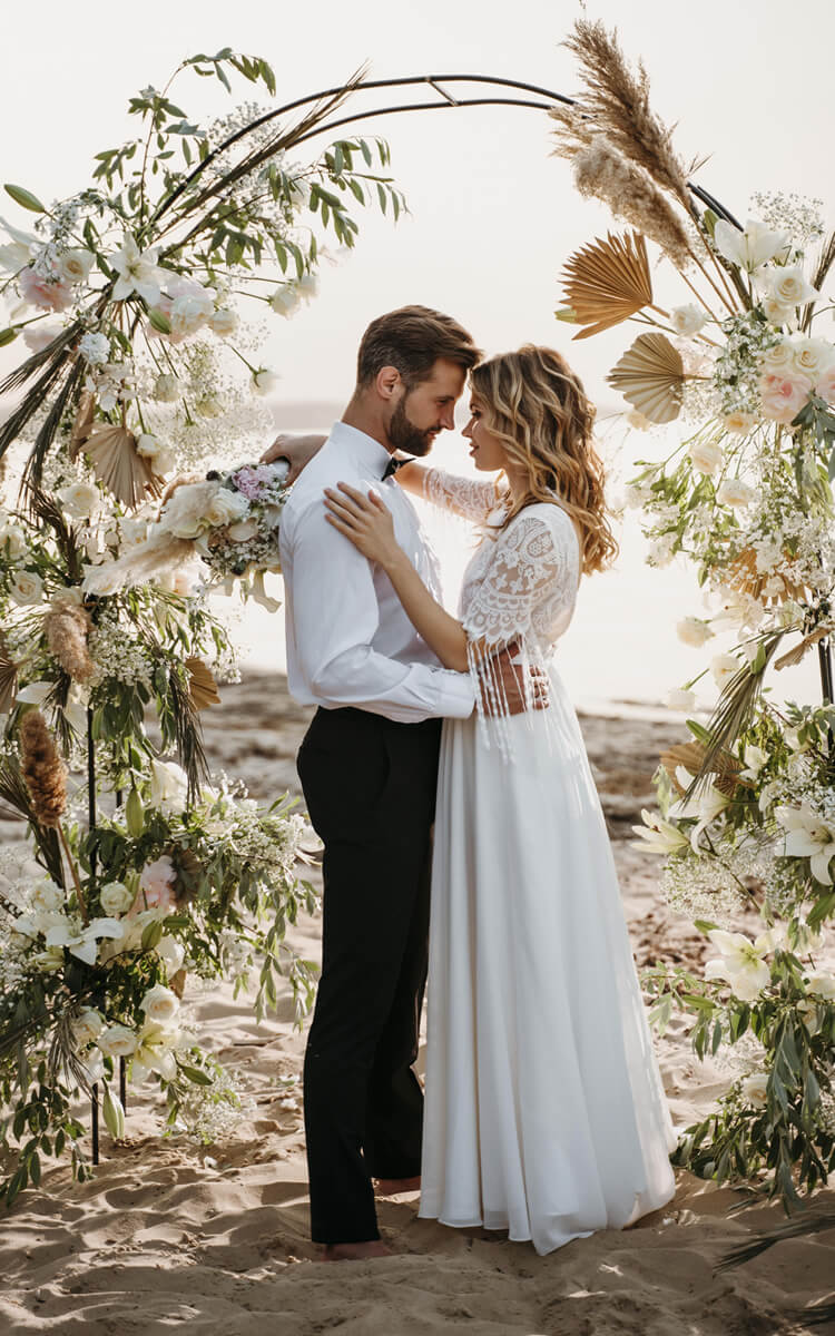 beautiful bride and groom on a beach wedding