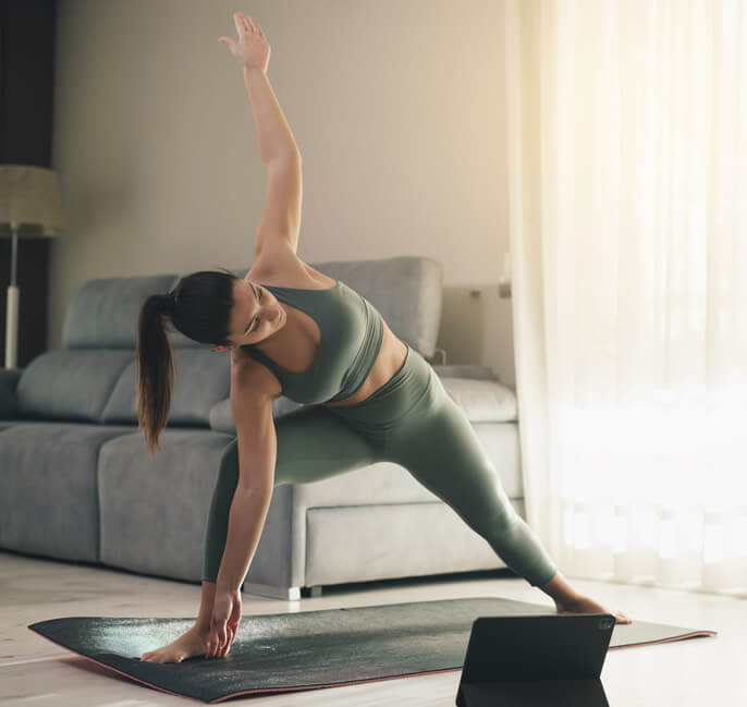 college student working out at her dorm room