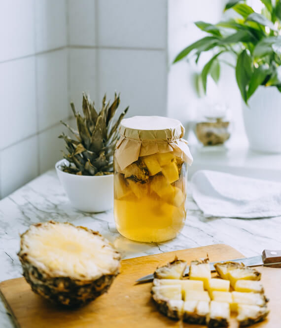 pineapple kombucha on a kitchen table