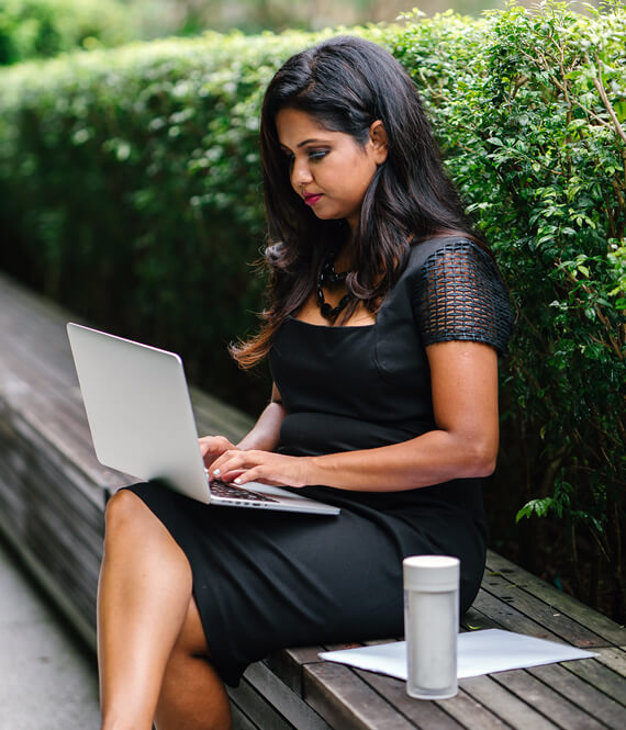 pretty indian woman working as a freelance writer