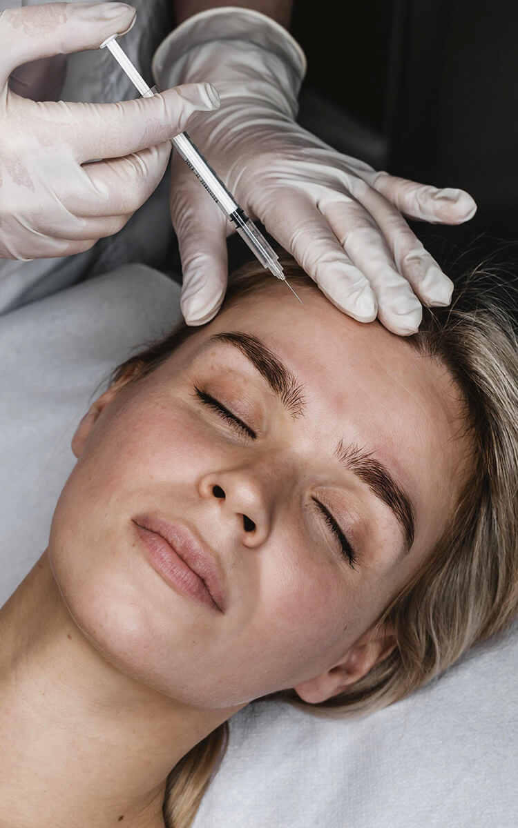woman receiving a preventative botox treatment at the salon