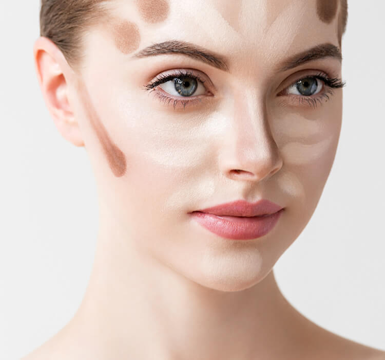 woman with makeup contouring lines on her face and nose