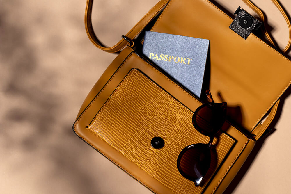 backpack with a passport and sunglasses