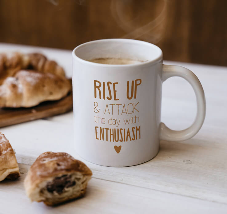 cup with motivational work quote