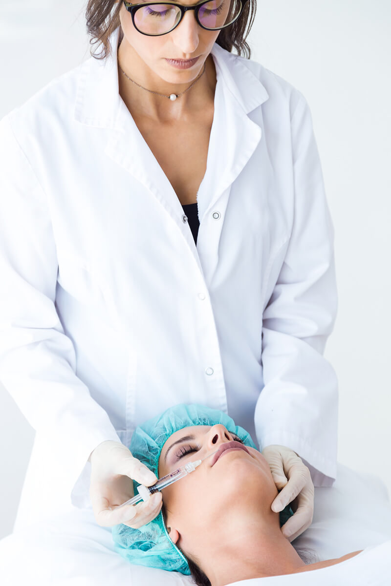 woman getting botox injections at a beauty salon