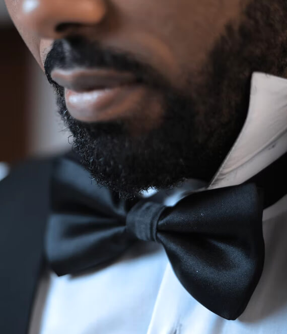 man wearing a black bow tie