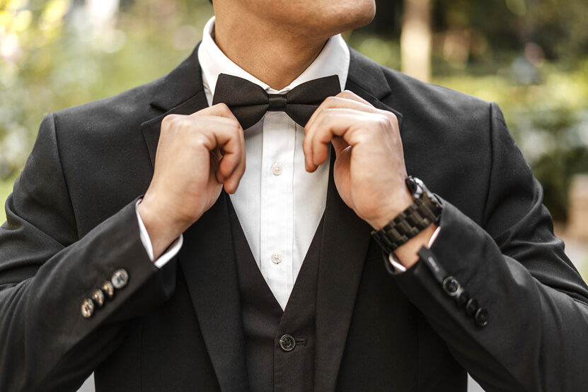 man with a black tuxedo and a bow tie