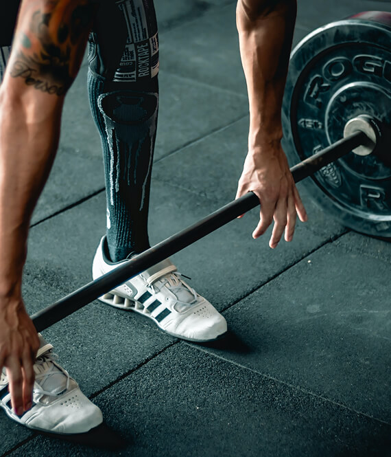 man working out in the gym lifting weights